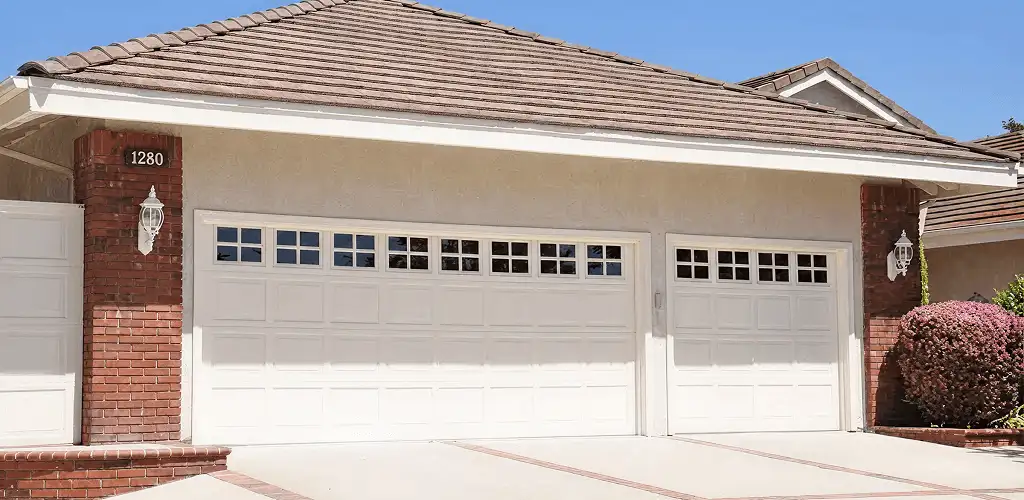 Residential garage door repair service for a double garage door in Detroit, MI