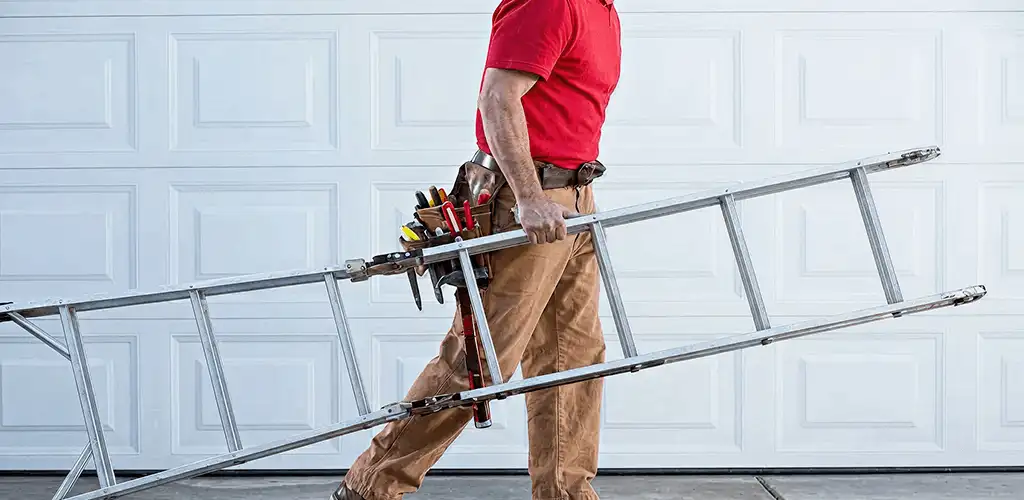 Garage door repair technician arriving with tools and ladder in Detroit, MI